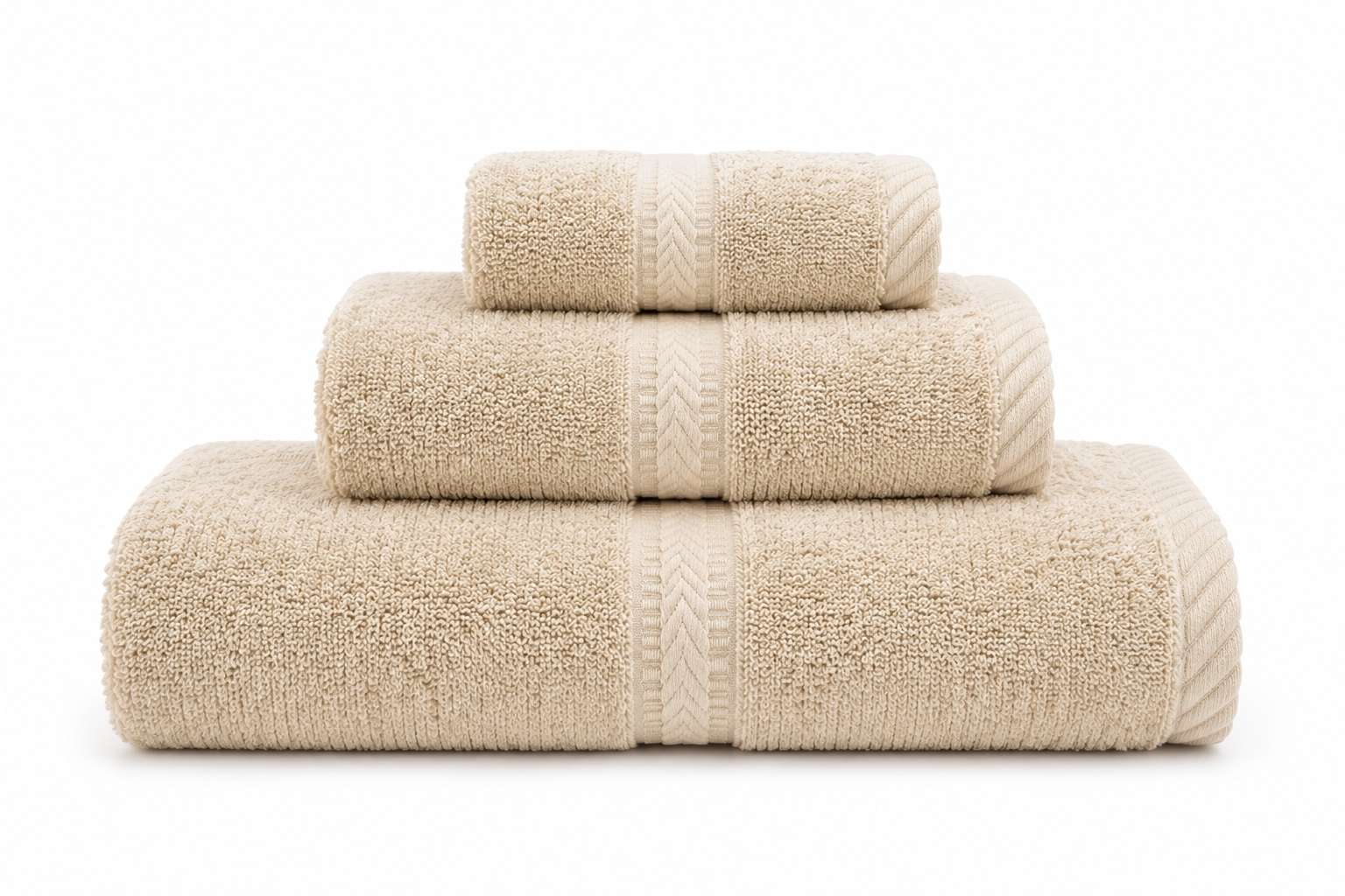 Royal Velvet cotton bath towels in beige folded on a shelf